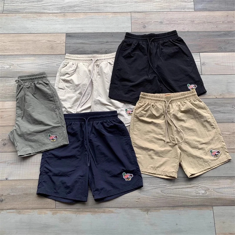 

HUMAN MADE Men And Women Lovers Duckling Sand Beach Solid Color Quick Drying Loose And Comfortable Versatile Lace Shorts Pants