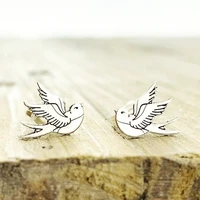 vintage metal hand carved bird shape womens mini personality stud earrings