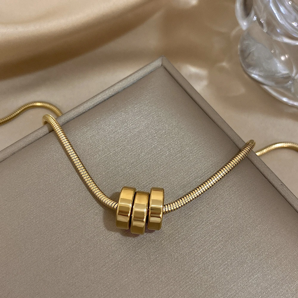 Трендовое позолоченное колье из нержавеющей стали со змеиными костями и кругами