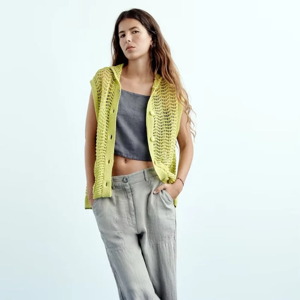 

2022 early autumn new women's casual solid color small lapel pocket decorated with long textured knitted hollow vest