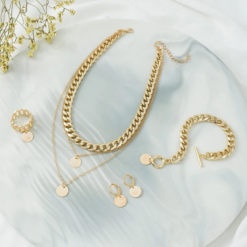 Женский комплект из колье серёг браслета и кольца