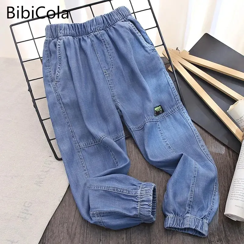 

Модные джинсы для мальчиков-подростков весенне-осенние детские штаны модные однотонные длинные брюки детские свободные противомоскитные ...