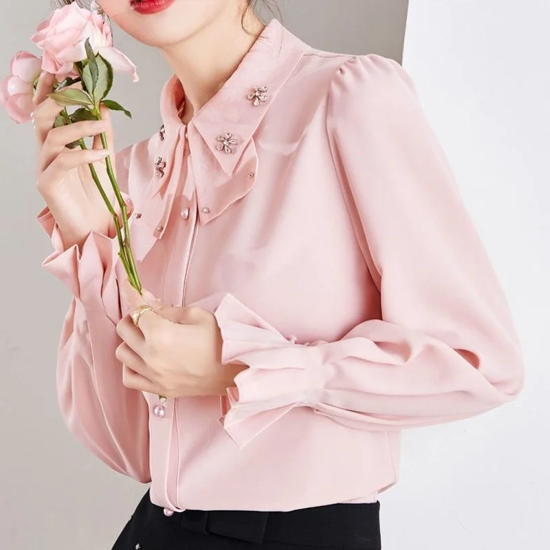 

2023 Spring and Autumn French Fashion Doll Neck Bow Tie Studded Beads Foreign Style Ruffle Sleeve Solid Color Versatile Shirt