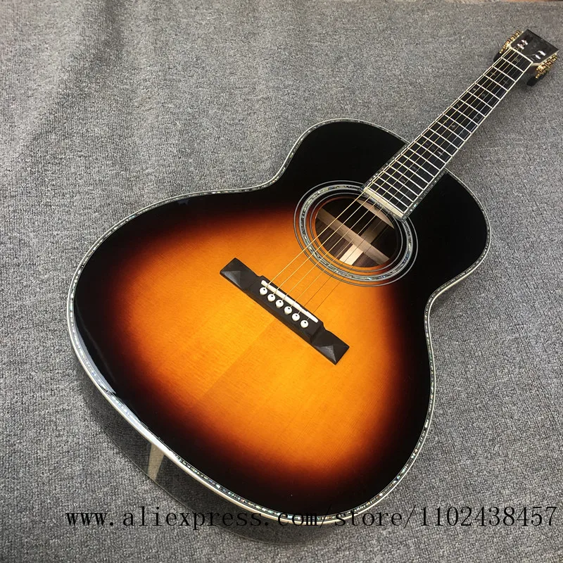 

Custom guitar, solid spruce top, rosewood sides and back, ebony fingerboard 39 "high-quality ooo series acoustic guitarras