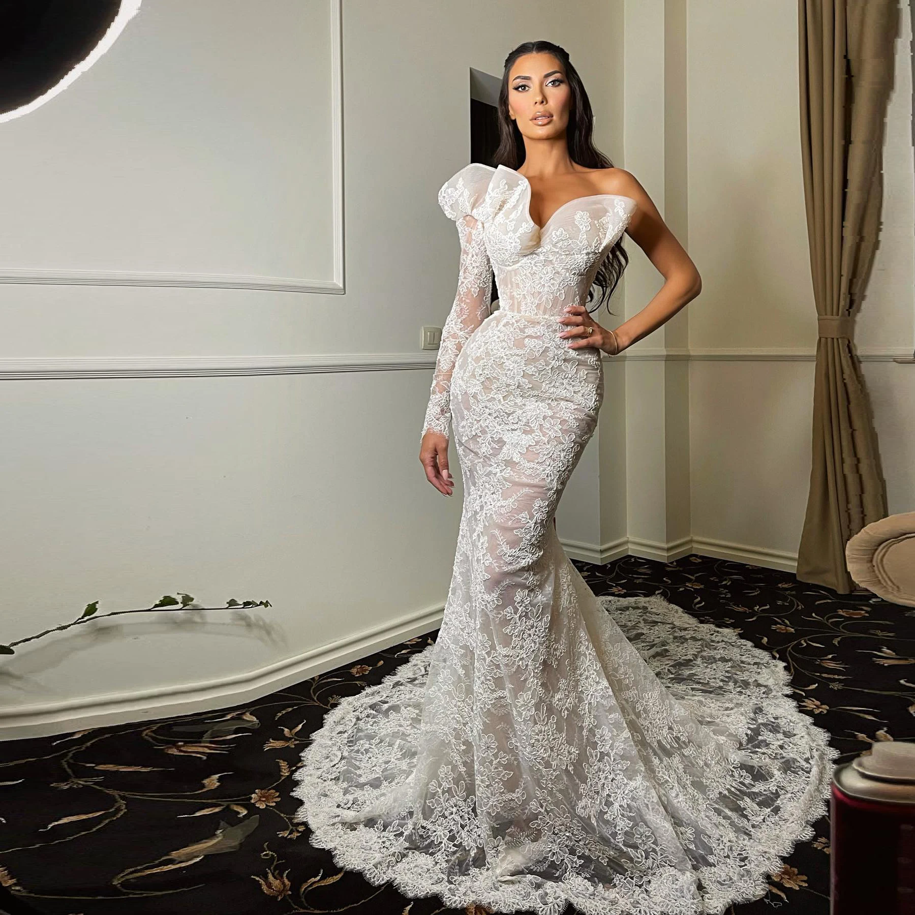 

Elegant white one-shoulder long-sleeved ruffled lace applique wedding dress