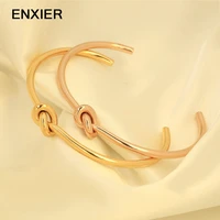 enxier trend simple open knot cuff bangles bracelet for women elegant gold color 316l stainless steel jewelry