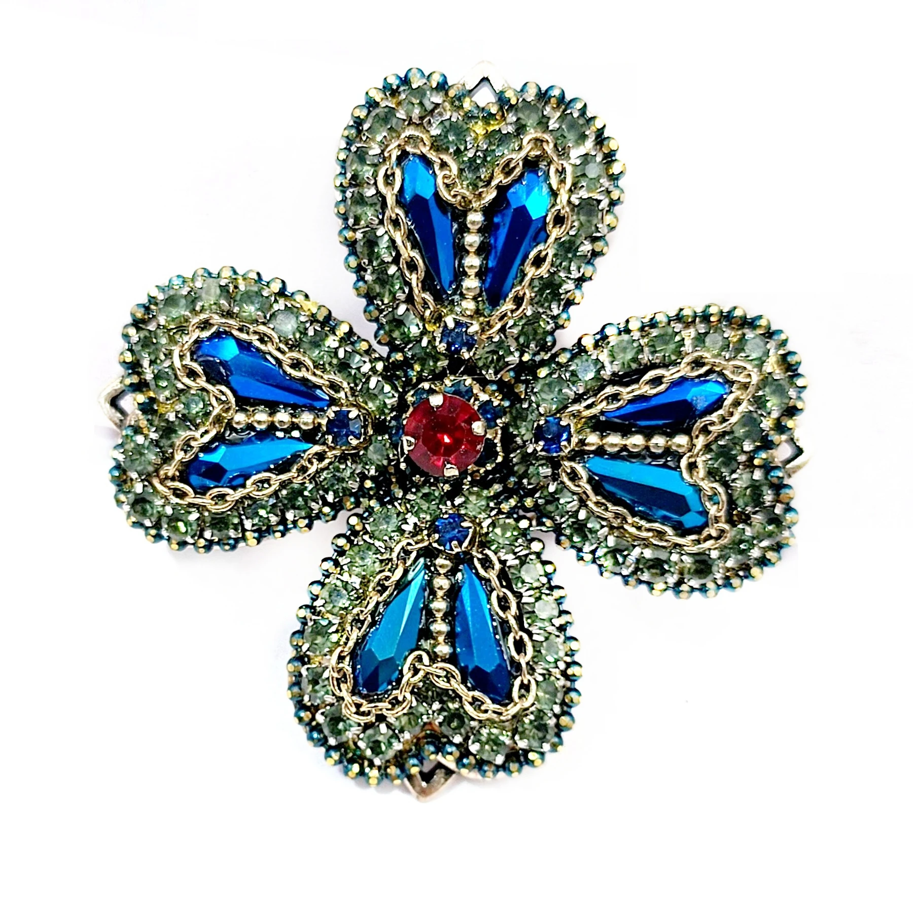 

Exquisite Vintage Crystal Hemmed Blue Rhinestone Cross Shaped Brooch Pin with Golden Chain Accent Four Petal Floral Jewelry