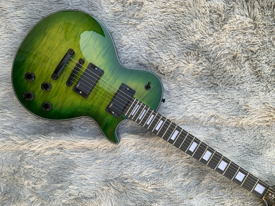 

In stock green color mahogany wood body with quilted maple top six string LP electric guitar, we can customize the guitar