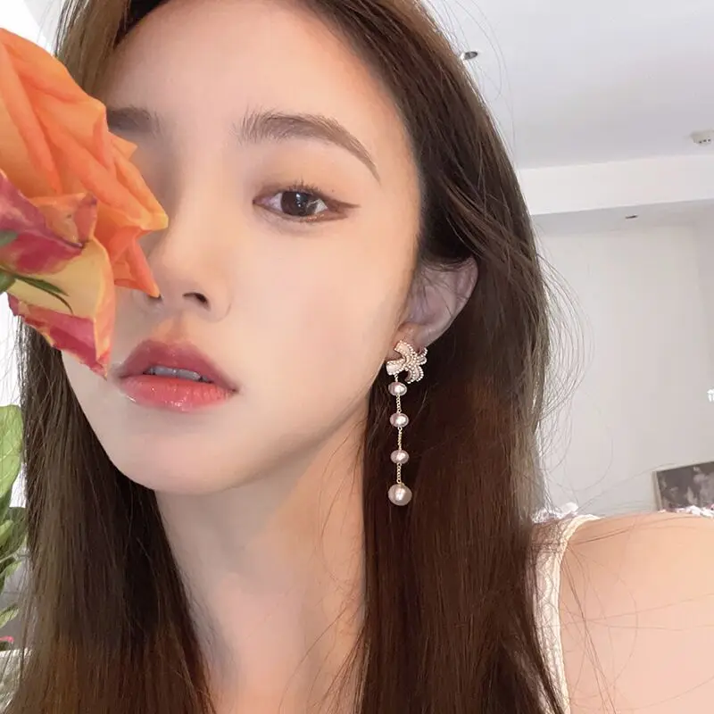 

New Korean bow pearl Tassel Earrings super fairy temperament atmosphere a two wearing earrings