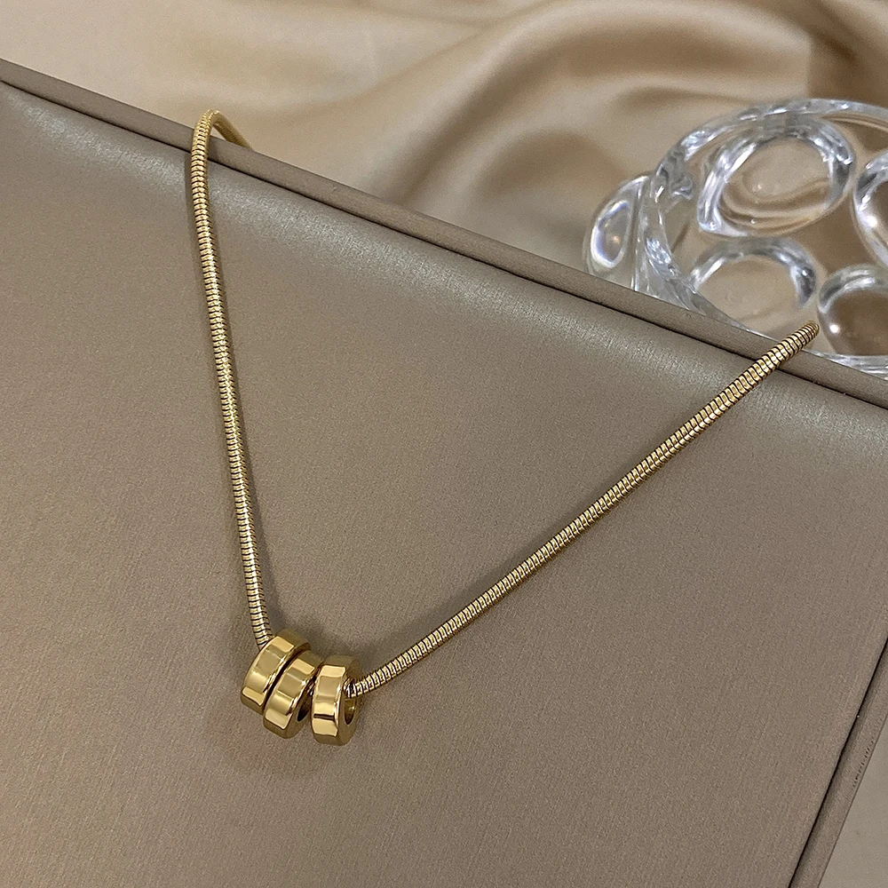 Трендовое позолоченное колье из нержавеющей стали со змеиными костями и кругами