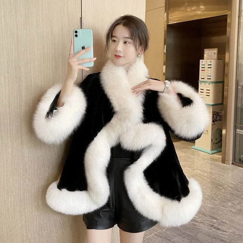 2022 autumn and winter new loose imitation fur black and white stitching warm air fashion all-match cape coat women