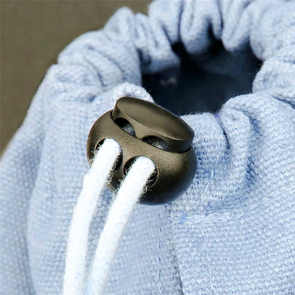 

10 шт., пластиковые фиксаторы с двумя отверстиями для одежды и брюк