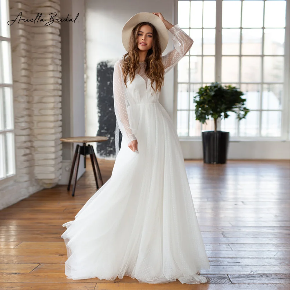 

Arietta Simple Dotted Tulle Beach Wedding Dresses Sheer Neckline Long Sleeves A-Line Bride Dresses Backless Wedding Gowns