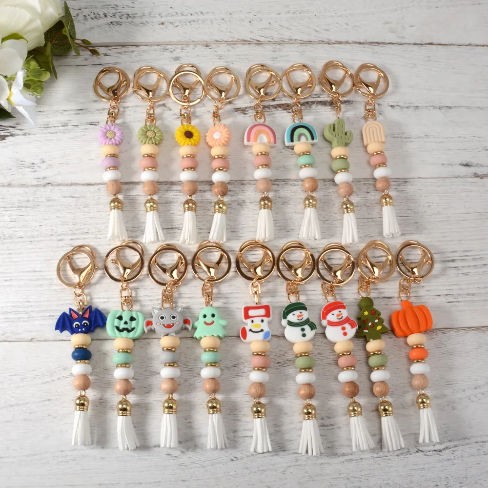 

2022 New Design Cute Hallow Christmas Keychain Silicone Bead Keyring wirh Tassel Bag Pendant Jewelry Gift