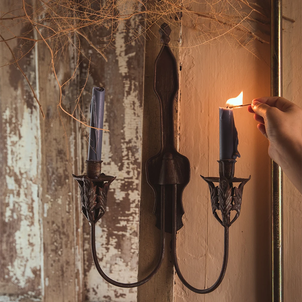 

rustic retro metal double candle holder hanging on the wall