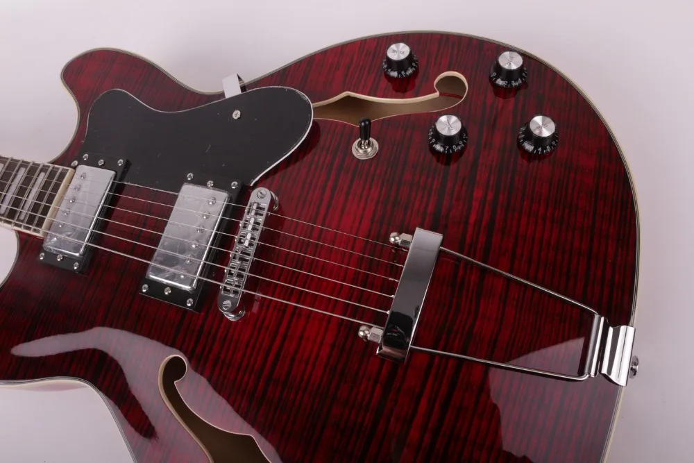 

Transparent dark red color with flame maple veneer electric jazz guitar