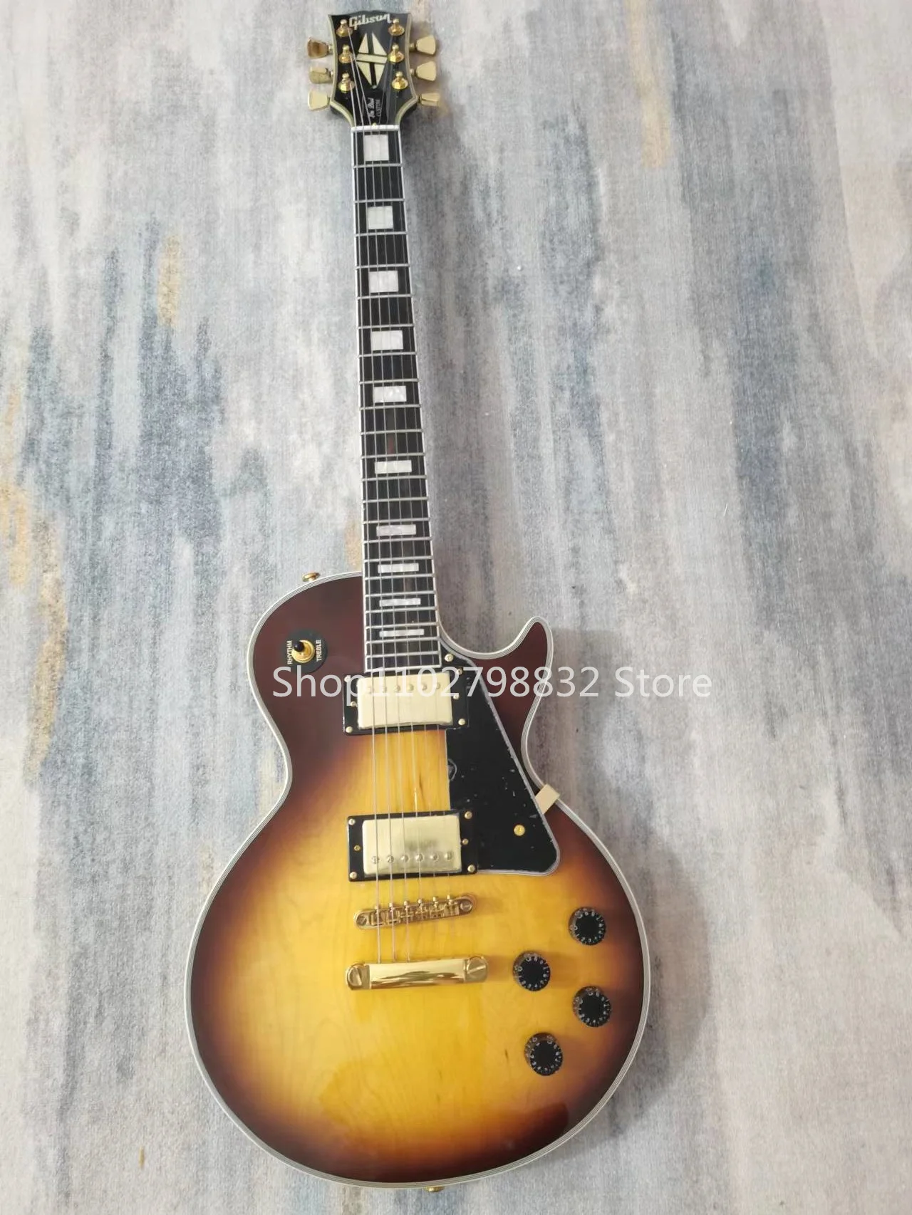 

6-string electric guitar, Rose Wood fingerboard, solid maple top, Peach Blossom Wood back, gold accessories, no shipping cost