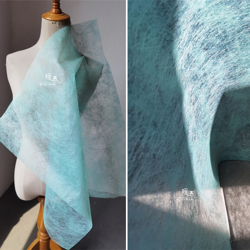 Дырчатая сетчатая ткань мятно-зеленого цвета линейная текстура искусство