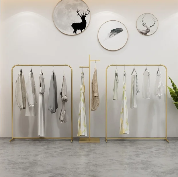 

Clothing store display shelf floor type golden women's clothing store shelf display iron hanger