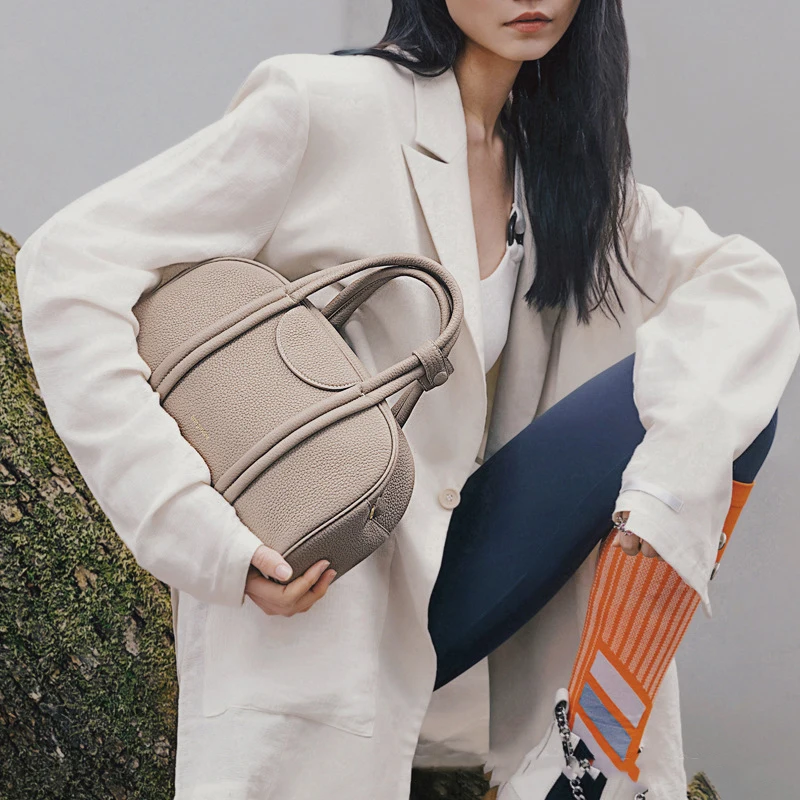 Trendy and stylish, minimalist bowling bag series, large capacity retro cowhide top layer, one shoulder portable crossbody bag