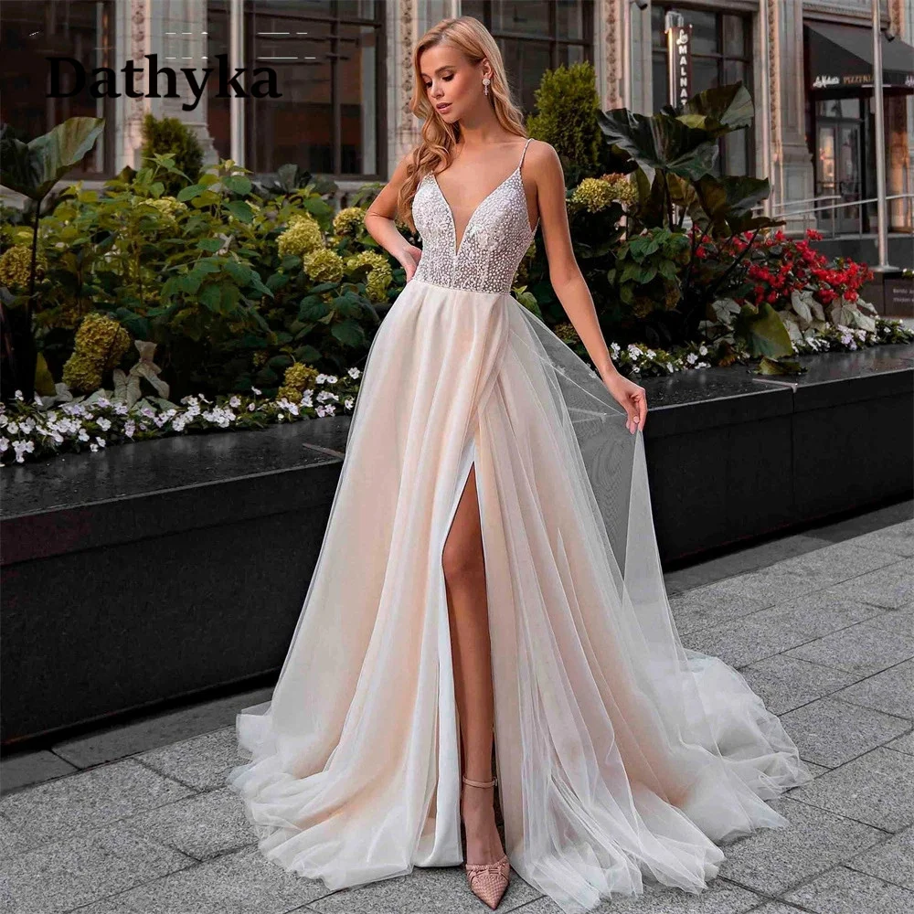 

Dathyka Deep V-Neck Slit Wedding Gown For Bride Court Train Sleeveless A-Line Pearls Appliques Tulle Backless Spaghetti Straps