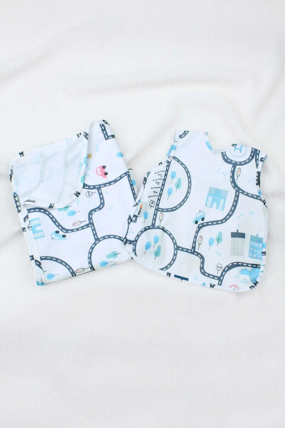 

Modakids City Pattern Fluid Bib and High Chair Cover