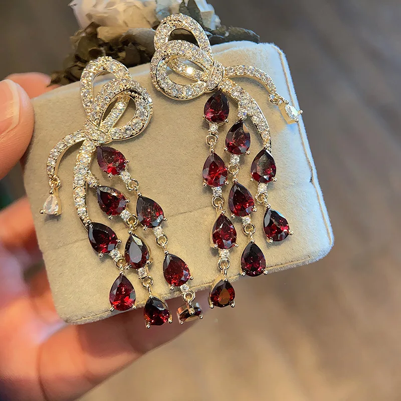 

Silver Needle Heavy Industry Zircon Butterfly Knot Water Drop Tassel Earrings