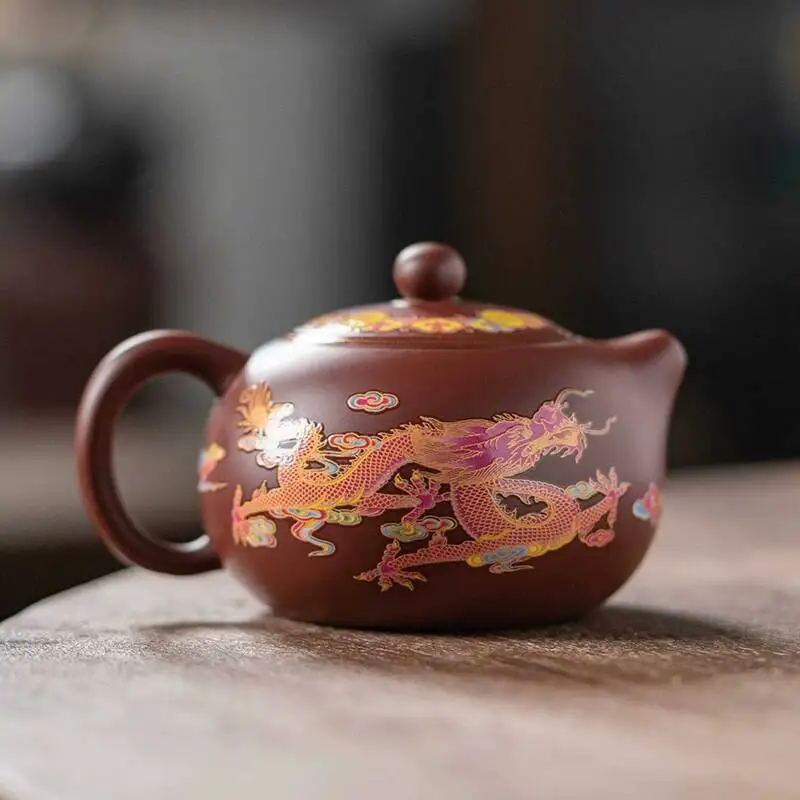 Фото Чайник Xishi Fengming из фиолетовой глины ручной работы с изображением Феникса и дракона, меняющий цвет, для домашнего использования, от Wu Chengzhi №1