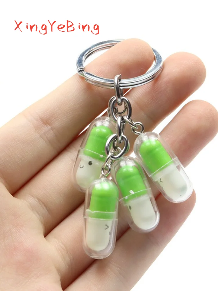 

New Cute Smiling Face Capsule Pendant Key Chain Pendant Fashion Creative Fun Pill Key Chain Male And Female Friend Gift