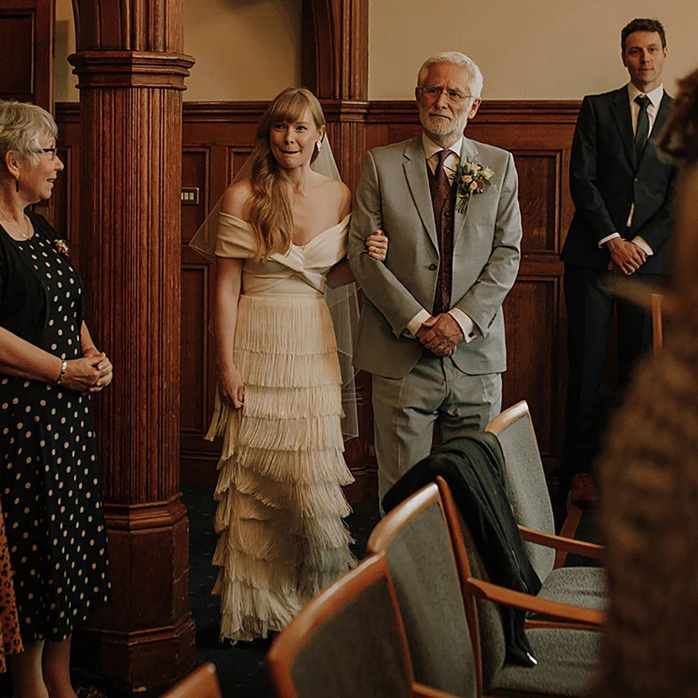 

Modern A Line Fringed Wedding Dress Custom Made Criss Cross Off Shoulder Crepe Maxi Beach Bridal Gowns with Layered Tassels