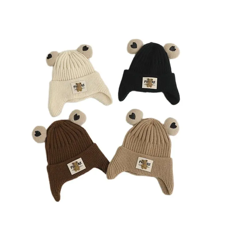 Рисунок 4 - Зимние детские вязаные шапки с