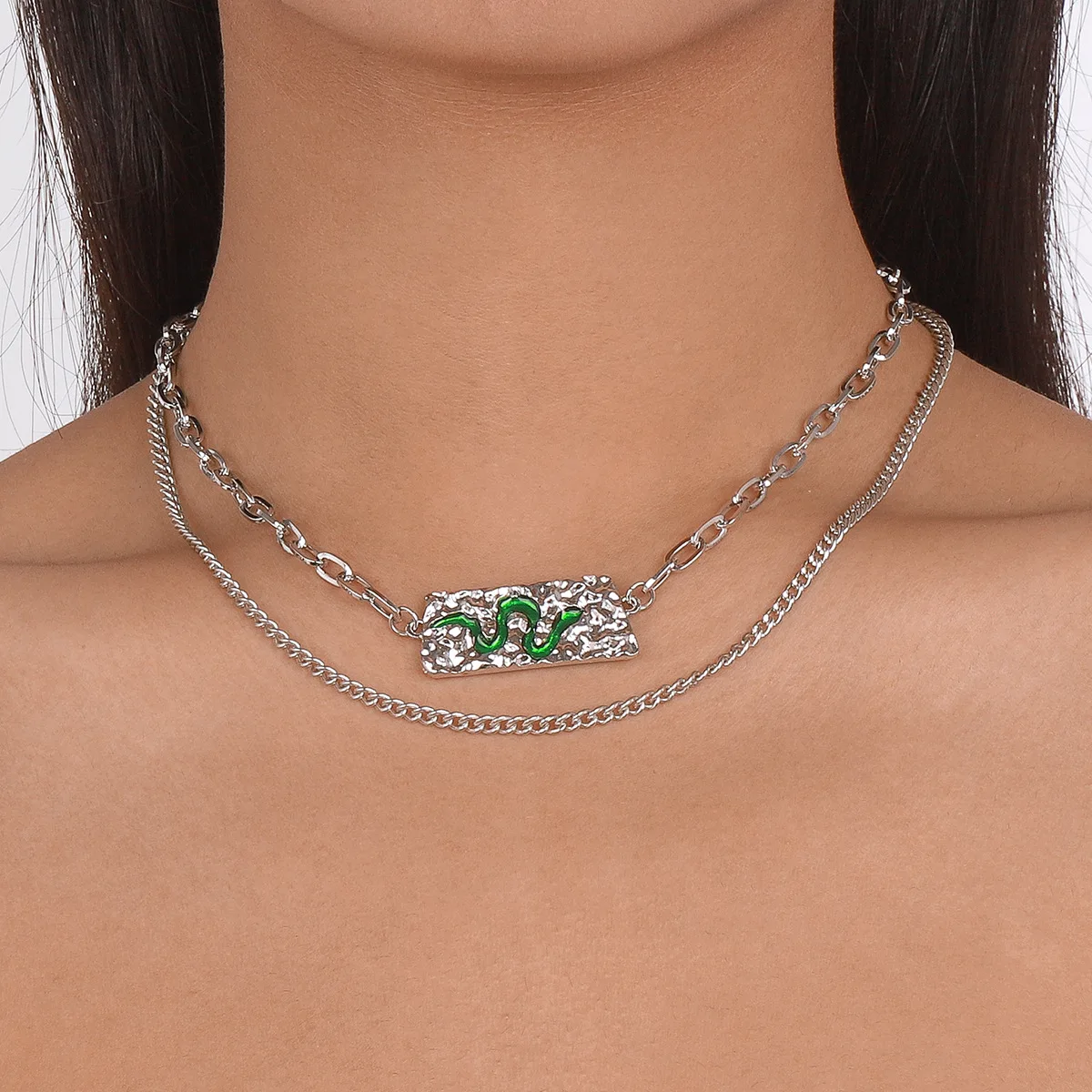 Accessories: Layered with a statement snake element necklace, exaggerated hip-hop punk style necklace