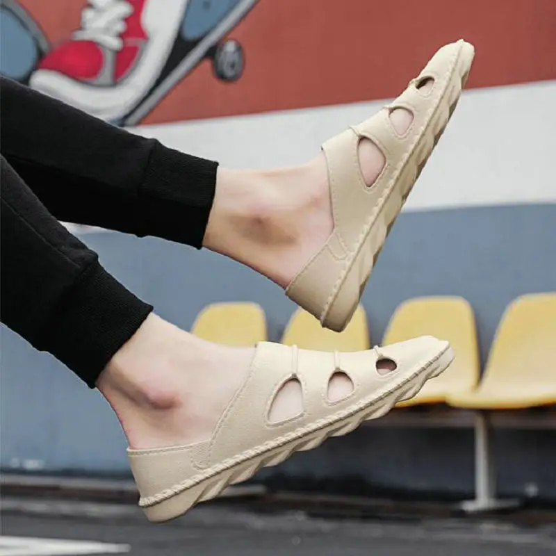 Driving shoes men's summer Baotou soft bottom sandals and slippers Year's new deodorant leather sandals men's casual beach shoes