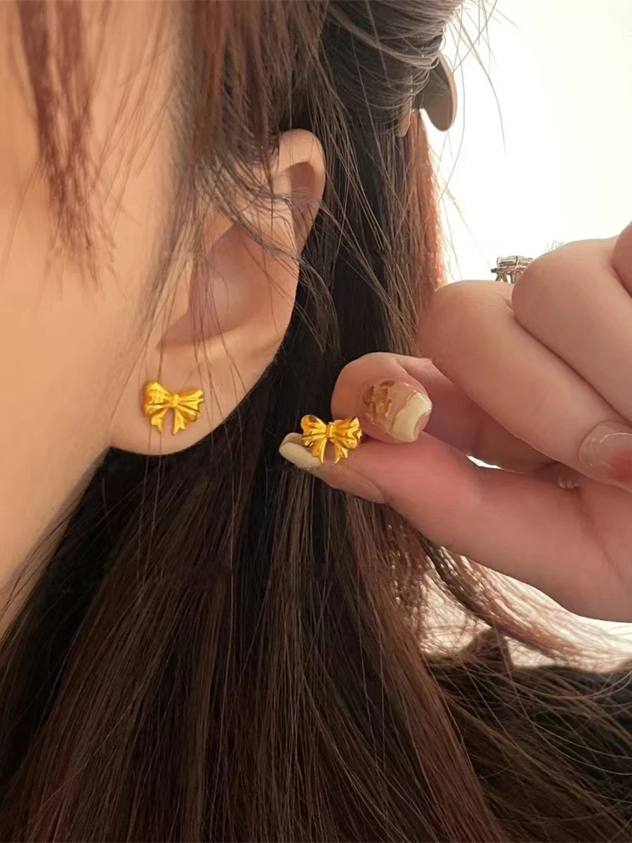 Серьги-гвоздики принцессы с бантом завернутые из 8-каратного золота не