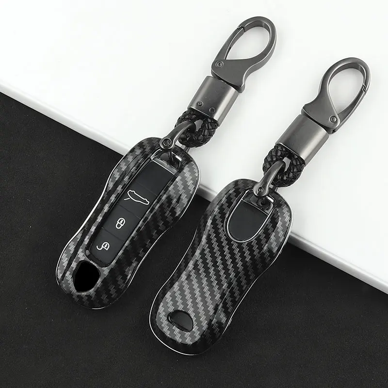 

The New Carbon Fiber Car Key Case Protective Shell Buckle is Suitable for Porsche Cayenne Macan 958 911 Boxster Cayman Panamera