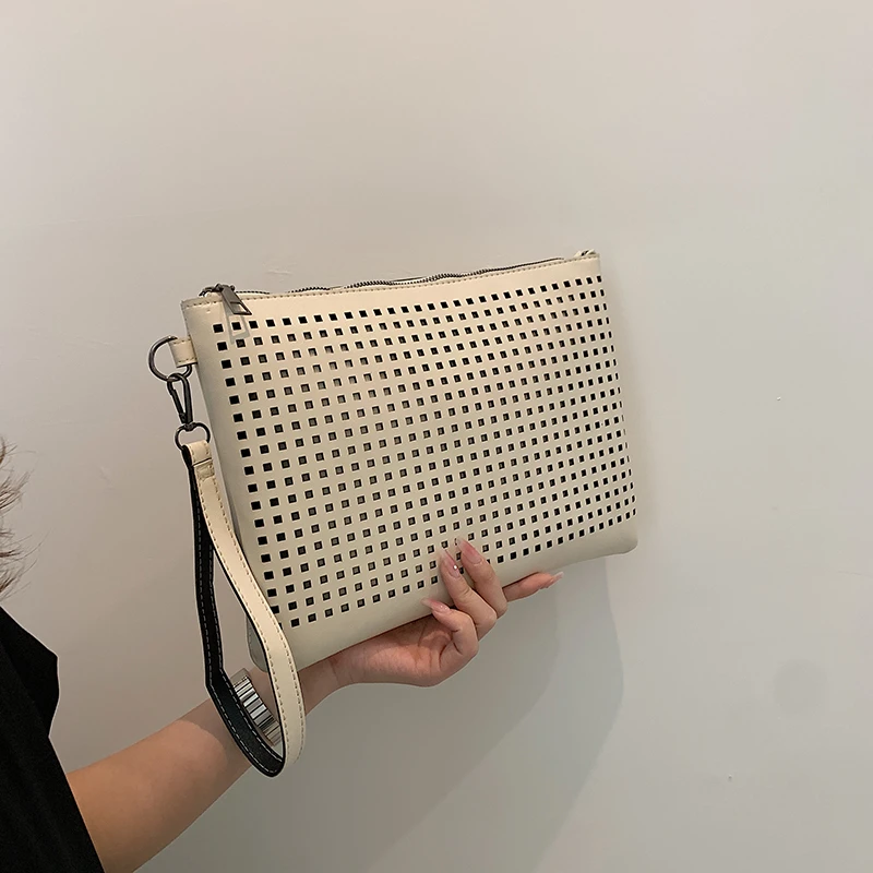 Hand bag simple temperament hollow-out bag female senior texture hand bag fashion envelope bag tide