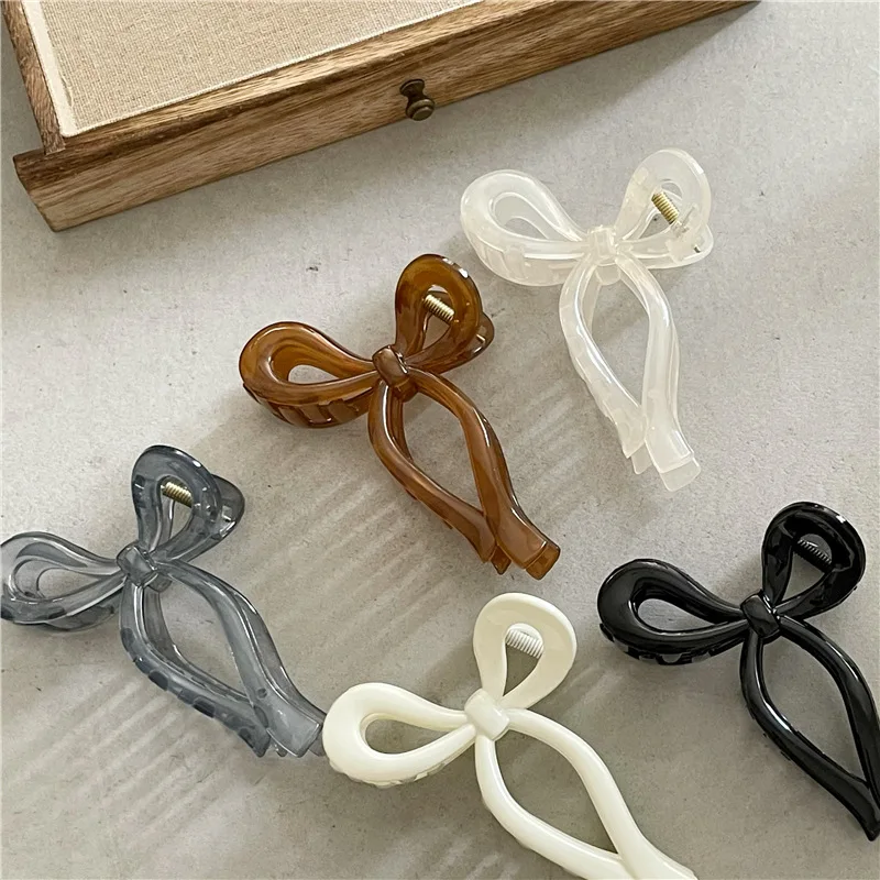 

Korean Version Simple Sense Three-Dimensional Line Ribbon Bow Large Hair Claw Jelly Texture Acrylic Shark Clip For Woman Girls