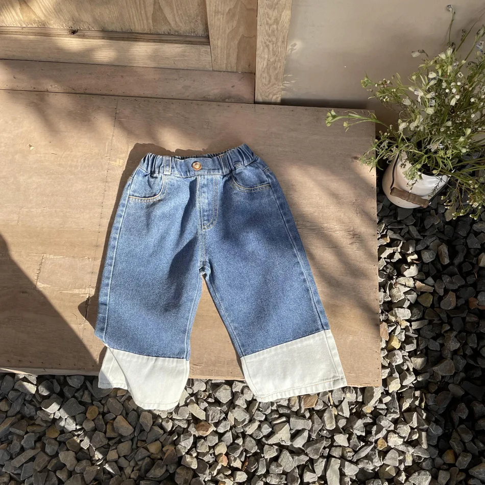 

Korean children's spring boys and girls loose straight leg pants children's stitching color casual jeans clothes Tidal current