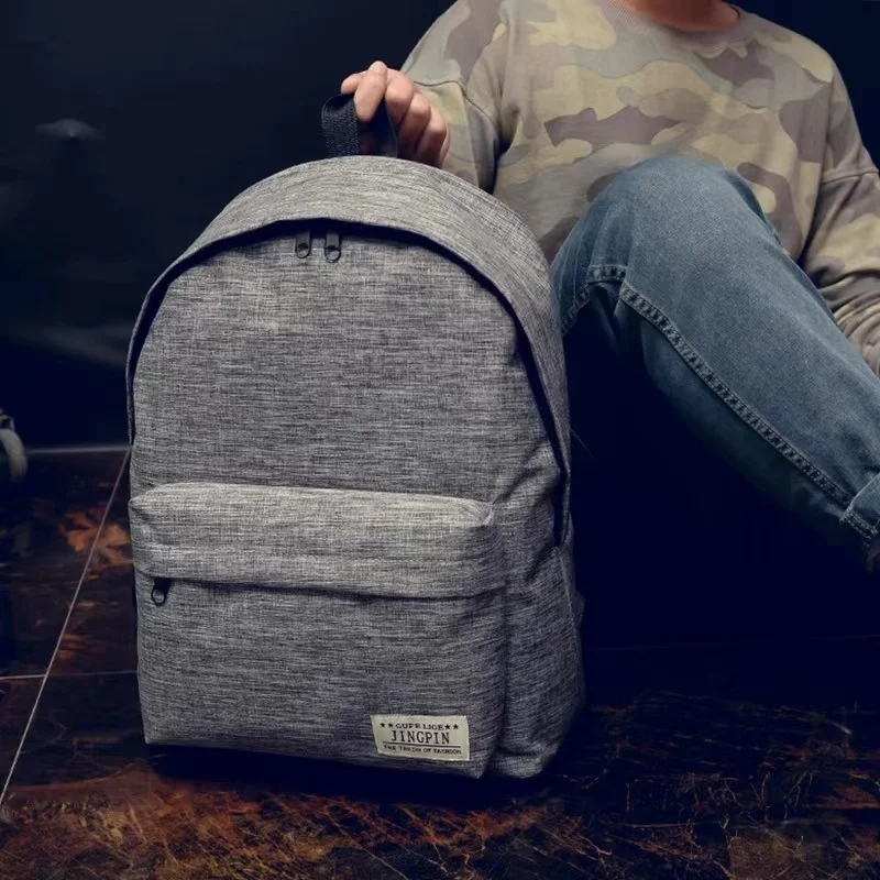 

Pure color canvas backpack student staff schoolbag Korean version of the trend of small fresh college fashion travel bag
