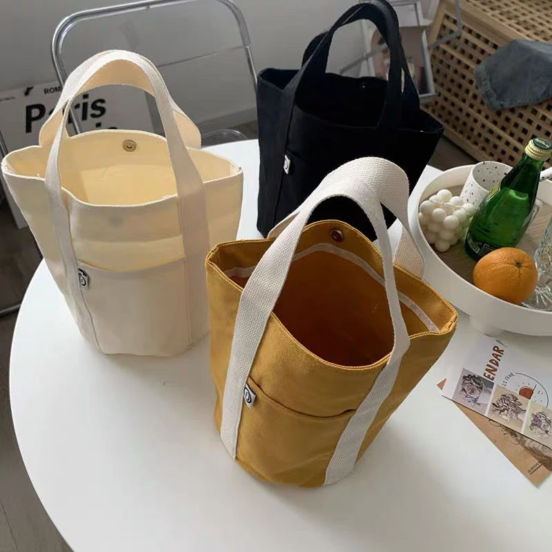 

new Canvas handbags Portable casual small bag High capacity lunch bag Bucket type simple and versatile shopping bag women man