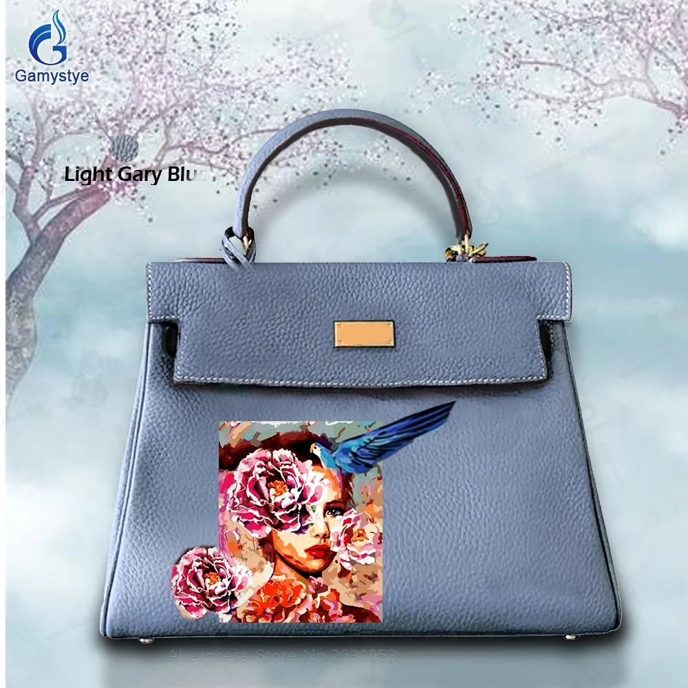 

Женская сумка из натуральной кожи с цветочным принтом