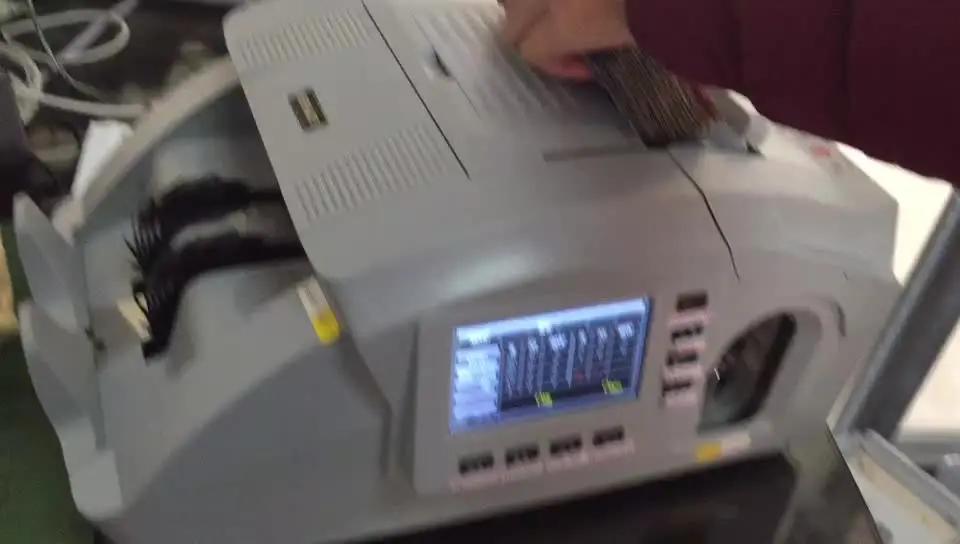 

Automatic counting and banding intergrated machine money currency detector