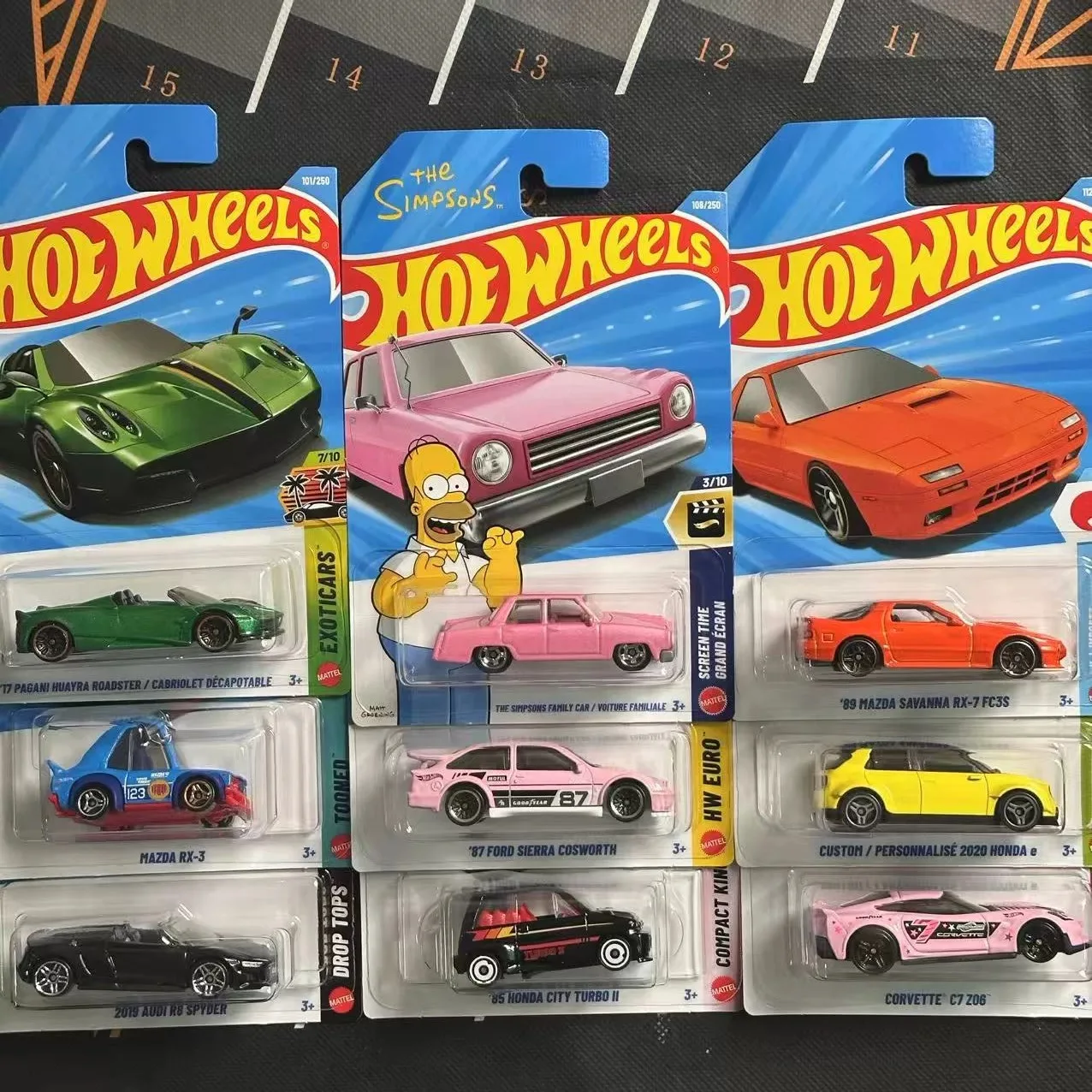 Фото Коллекционная модель автомобиля Hot Wheels 1/64 Mainline Series E Case SIMPSONS PAGANI AUDI MAZDA DODGE, литая под давлением №5