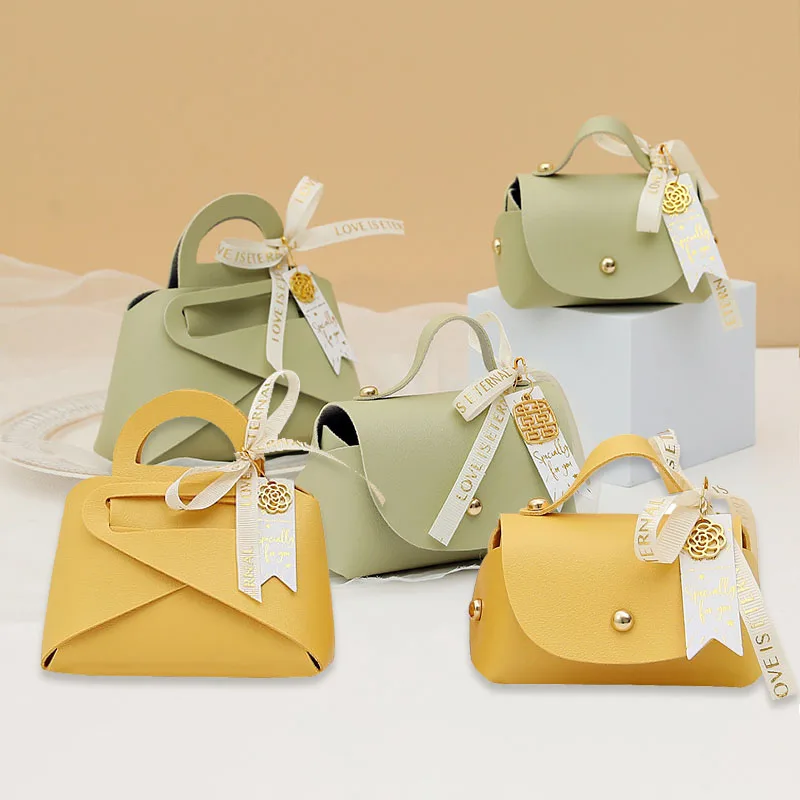 

Ribbon Bow Leather Gift Box Handbag Shape with Hand Candy Bag Packaging Box Wedding Favors Gift Box Baby Shower Party Supply
