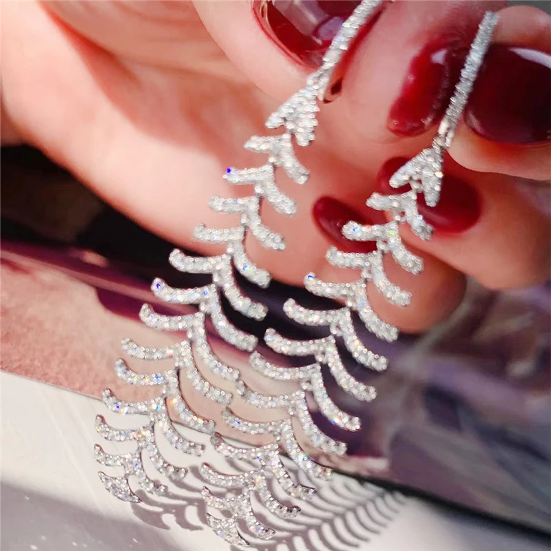 

Женские серьги-гвоздики в виде перьев, с фианитом