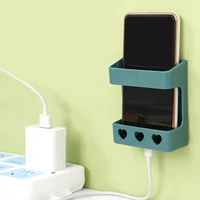 wall mounted storage box remote control storage organizer mobile phone charging stand self sticky wall shelf phone plug holder