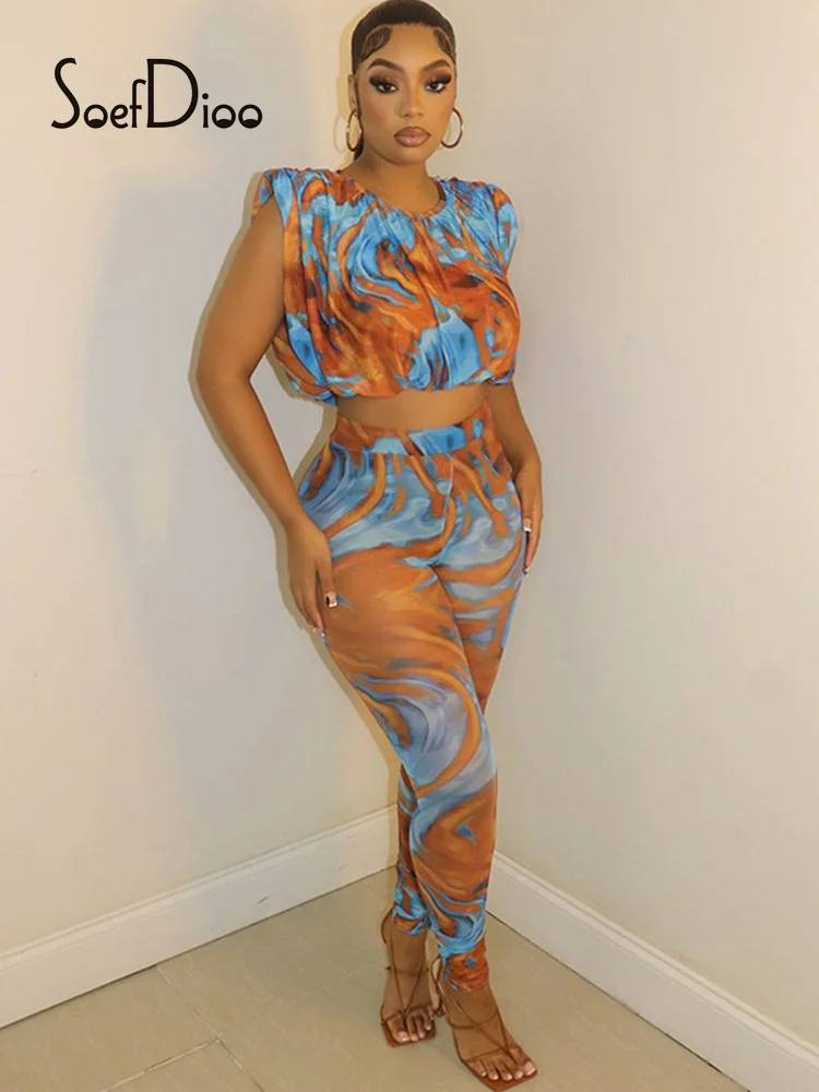 

Комплект из двух предметов Soefdioo с разноцветным принтом, женские сексуальные укороченные топы с рюшами и леггинсы из прозрачной сетки, подхо...