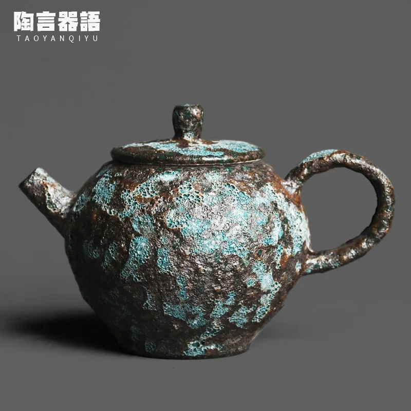 

Vintage wormhole bronze glaze round hand-held teapot handmade rough pottery relief texture kung fu tea ceremony single pot