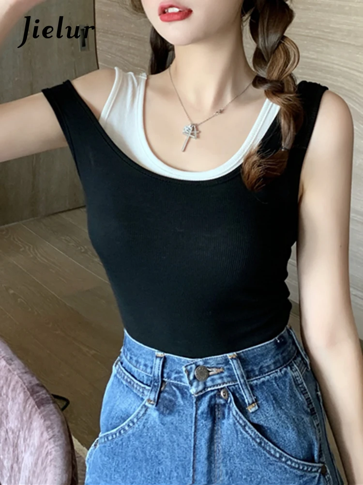 

Jielur цвет заклинаний черный белый топ на бретелях белый 2022 летняя облегающая майка женская искусственная двойка женский топ полые базовые м...