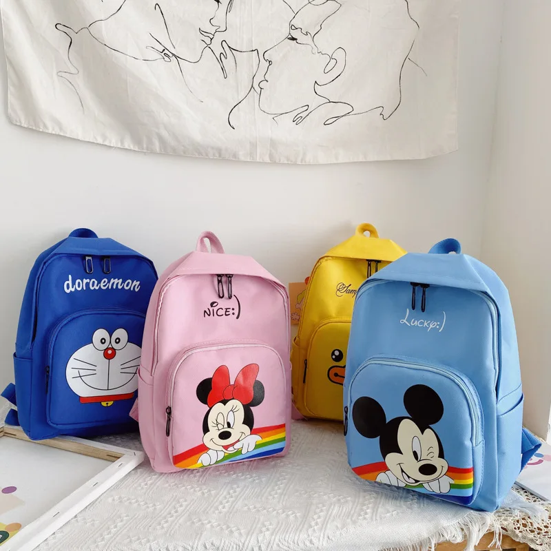 

Милые Мультяшные Новые рюкзаки для маленьких мальчиков и девочек с принтом Микки и Минни Детские нейлоновые кожаные сумки через плечо школ...